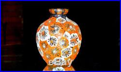 ADRIEN MAZOYER. Vase boule à col étranglé, en verre à décor de fleurs émaillées